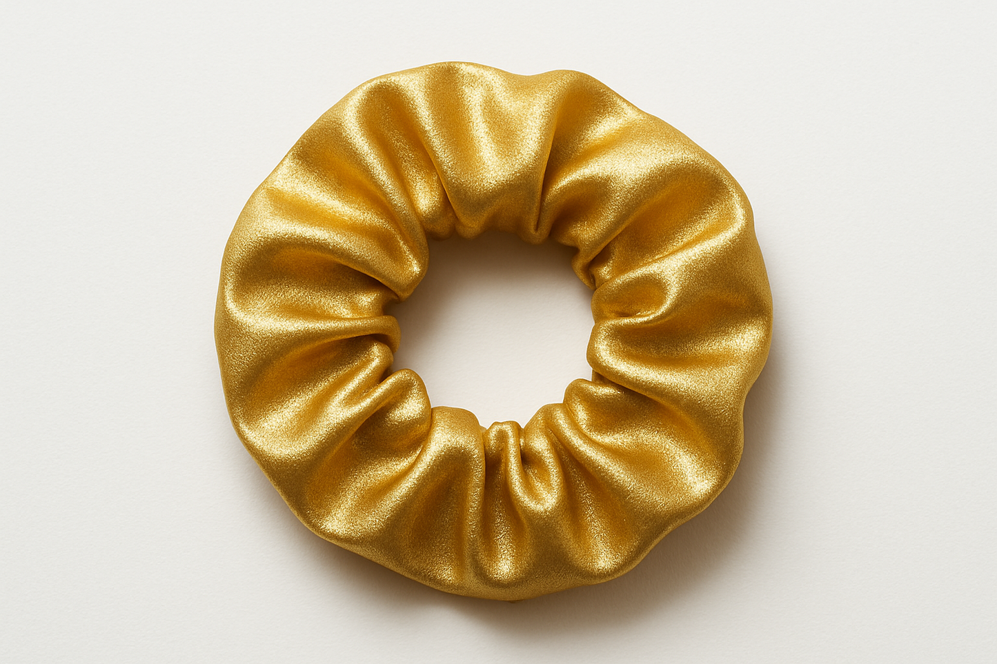 A medium size scrunchie in gold